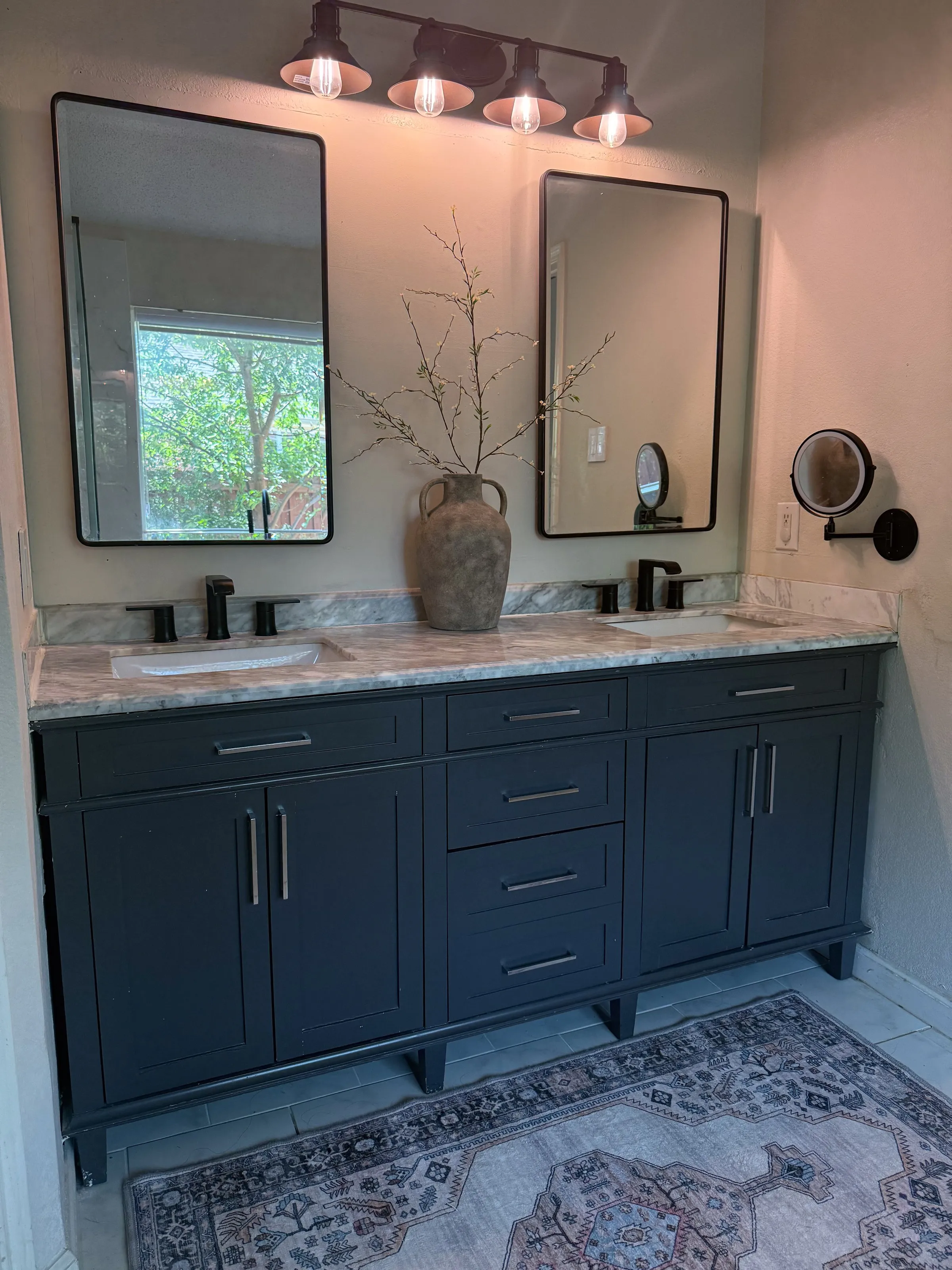 Custom navy double bathroom vanity with marble countertop and dual sinks by IonBuilds Plano TX