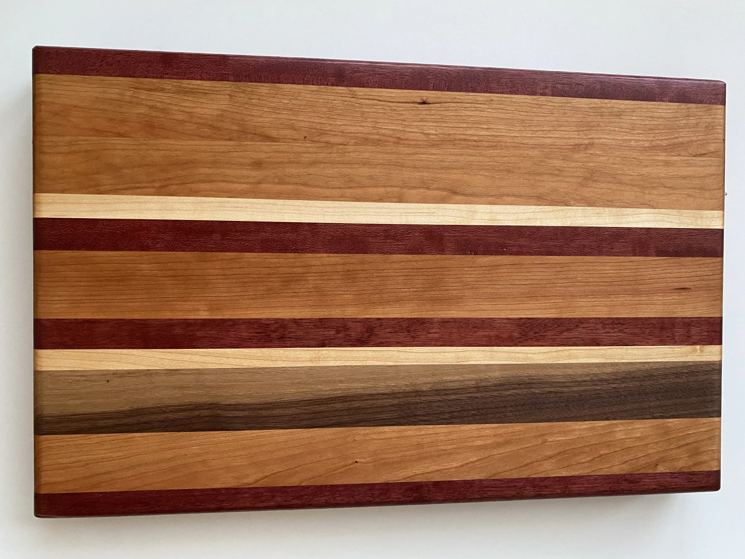 Custom end-grain cutting board in black walnut and hard maple handmade by IonBuilds in Plano, TX
