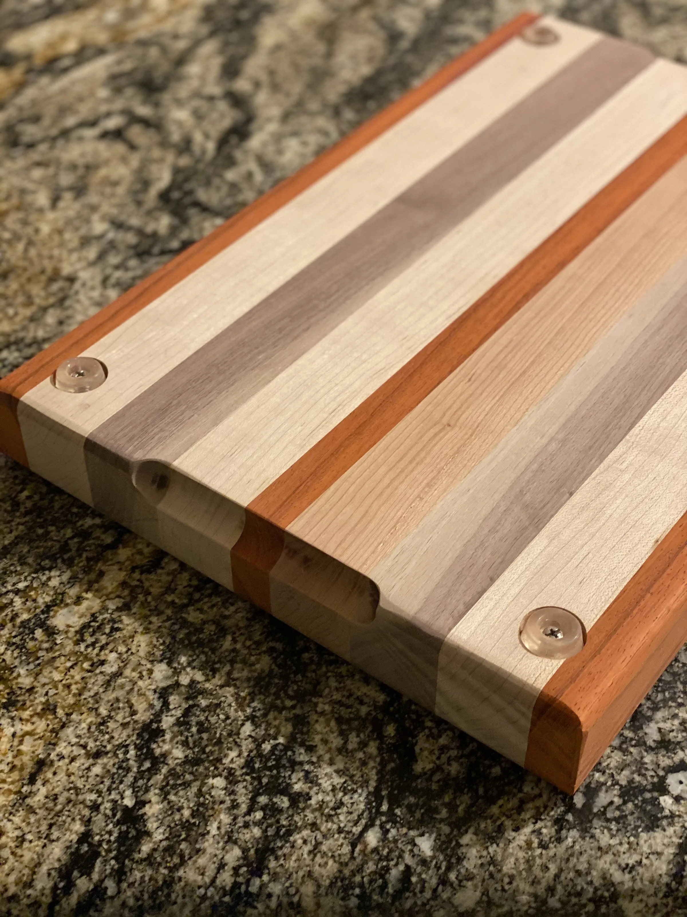 Custom hardwood cutting board with charcuterie arrangement by IonBuilds Plano TX