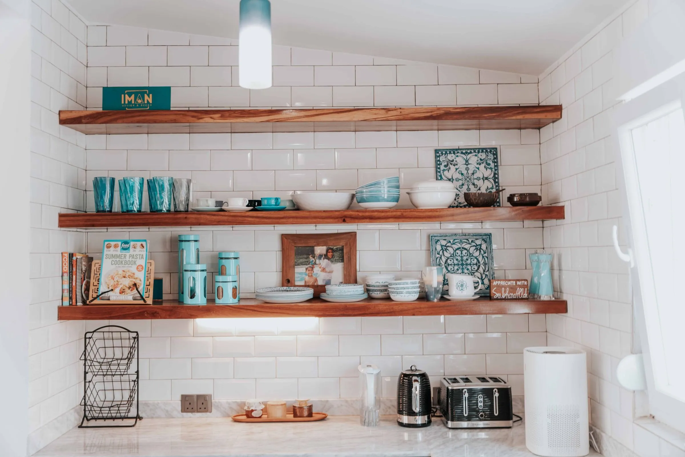 Custom solid wood floating kitchen shelves with subway tile by IonBuilds Plano TX