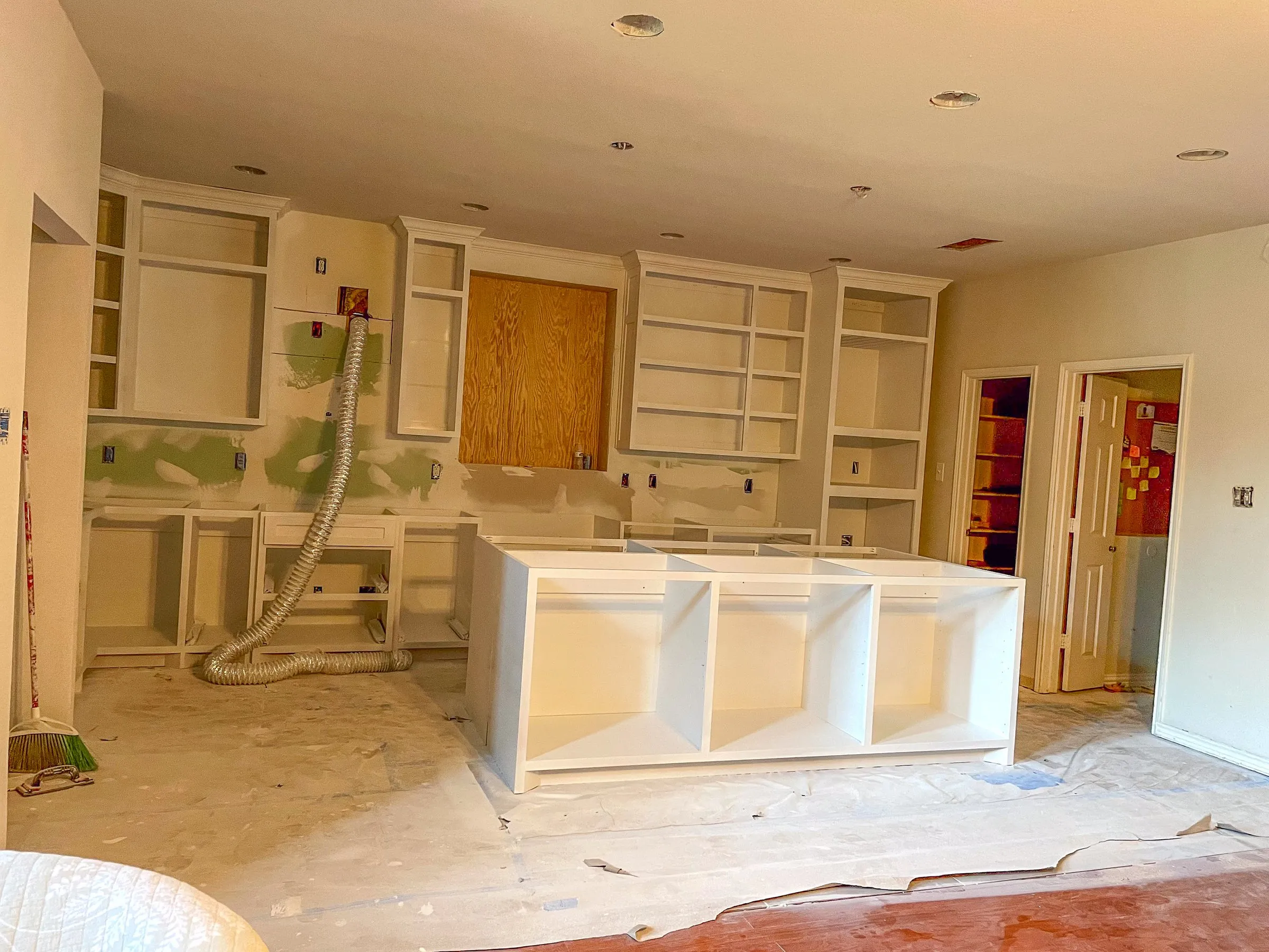 White kitchen island with seating overhang by IonBuilds