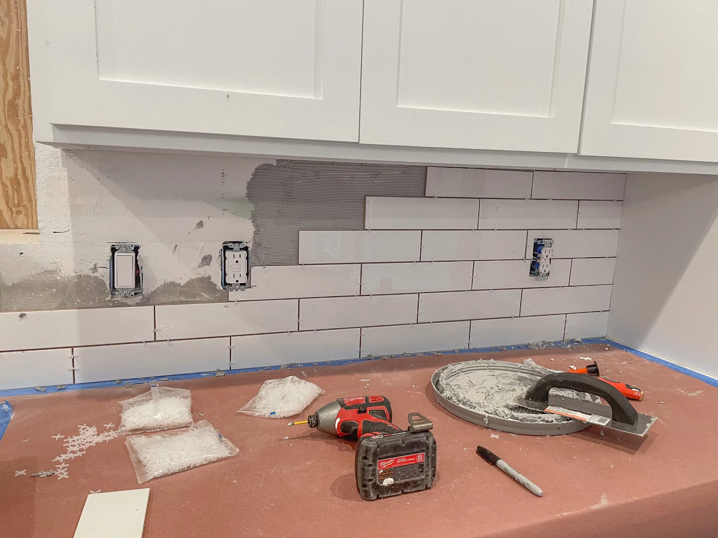 Subway tile backsplash installation by IonBuilds