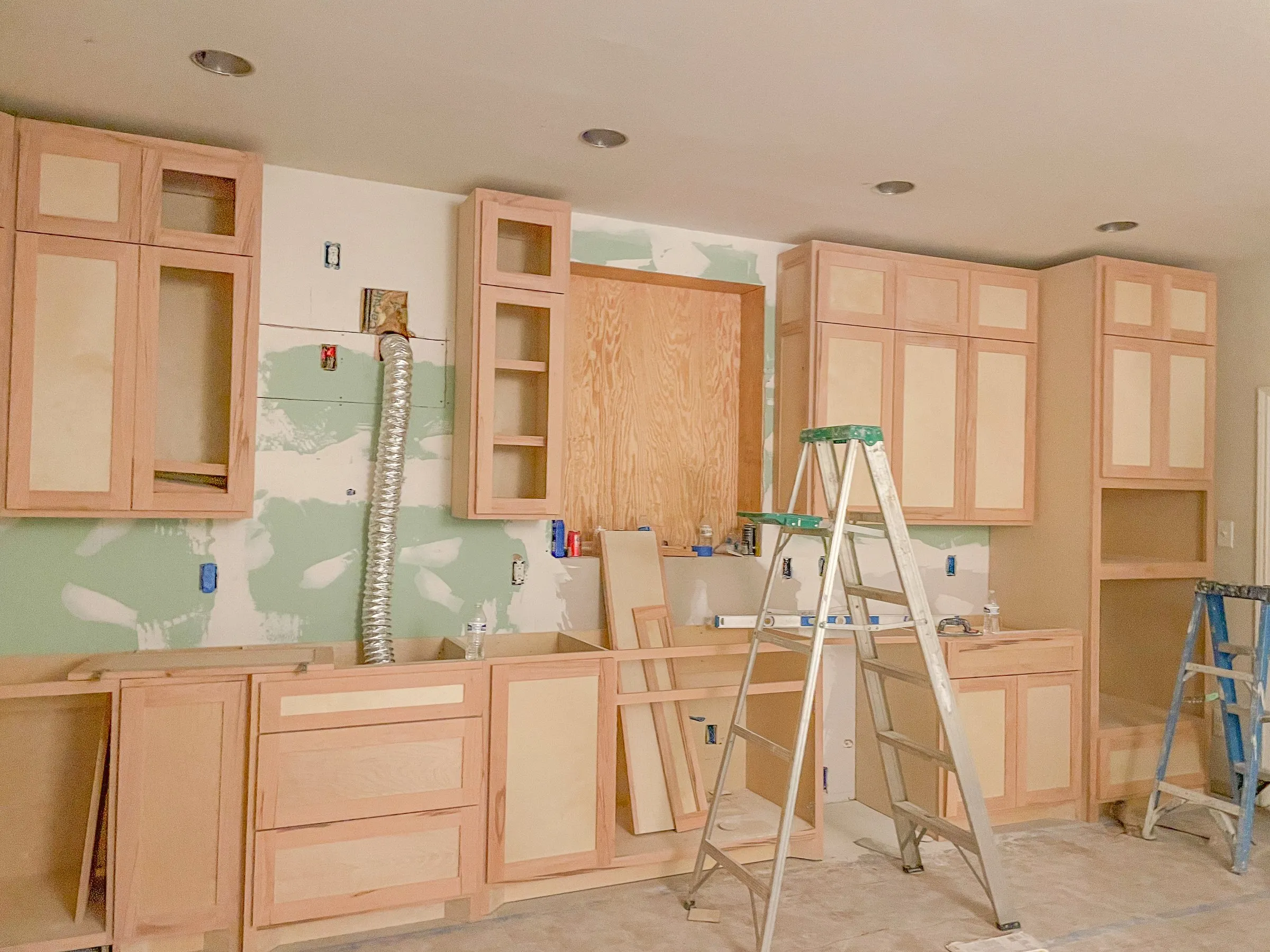 Custom white kitchen with center island by IonBuilds
