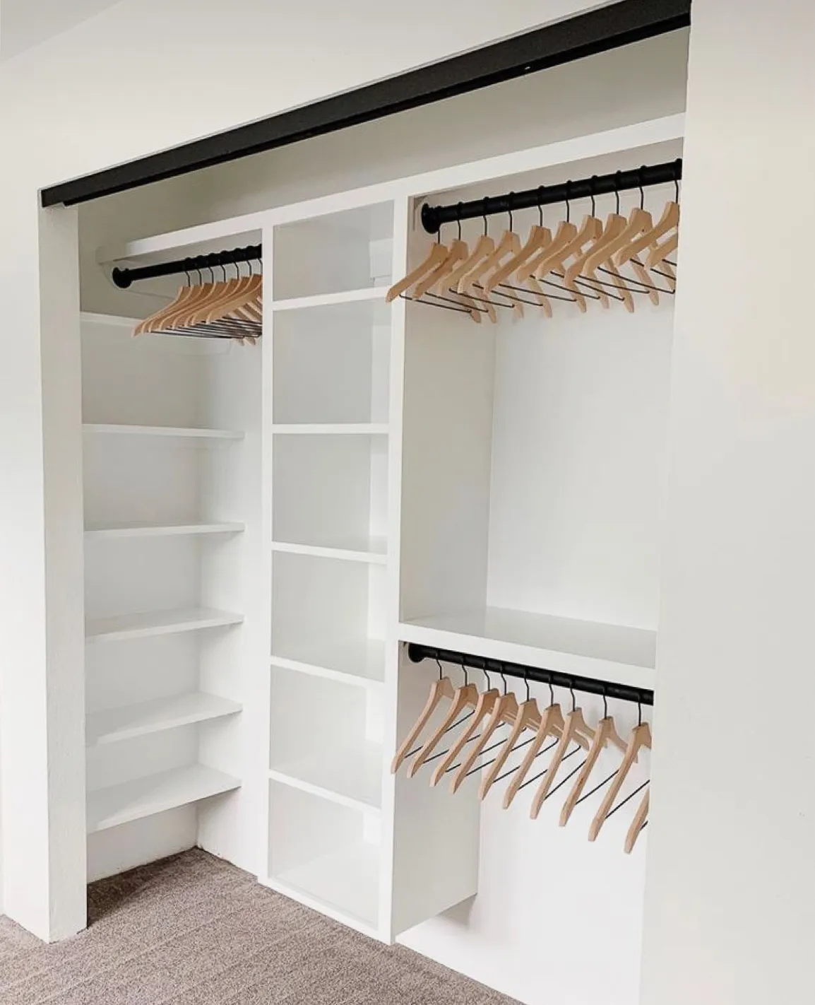 Custom walk-in closet hanging towers and shoe shelving by IonBuilds